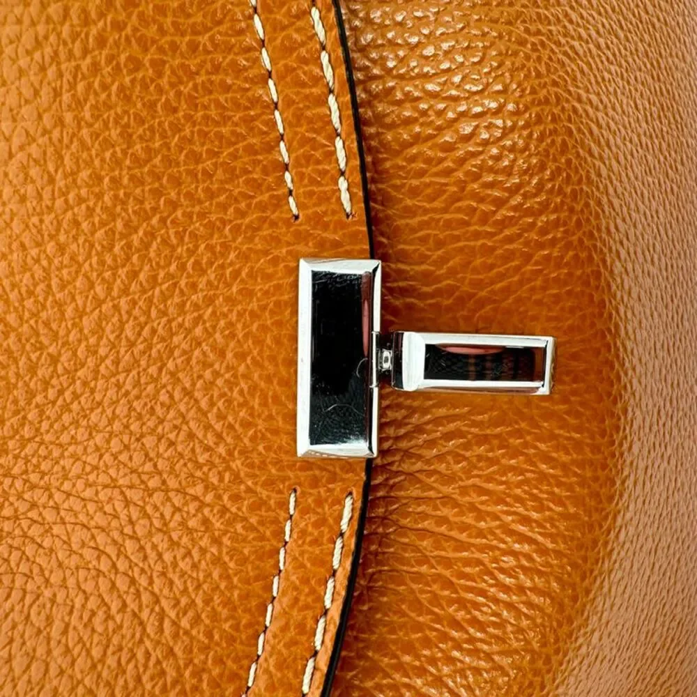 Totême T-Lock Grained-Leather Clutch in Tan Brown Leather